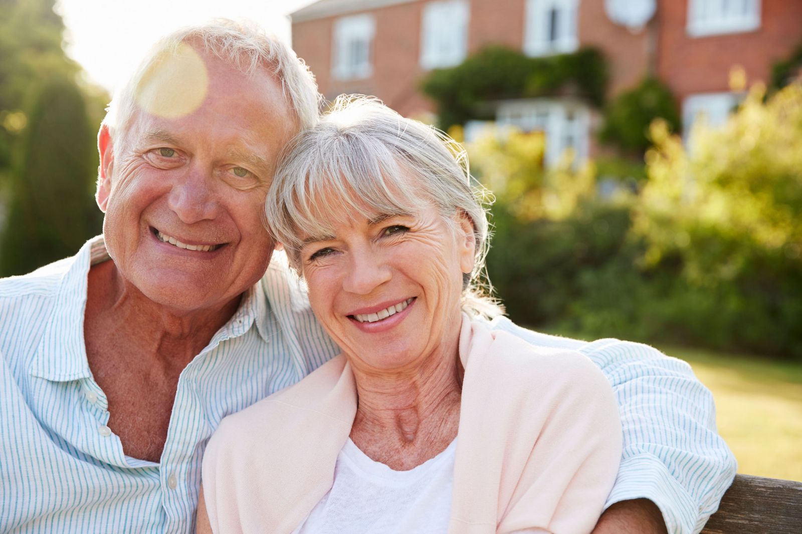 Couple sitting together on a garden bench